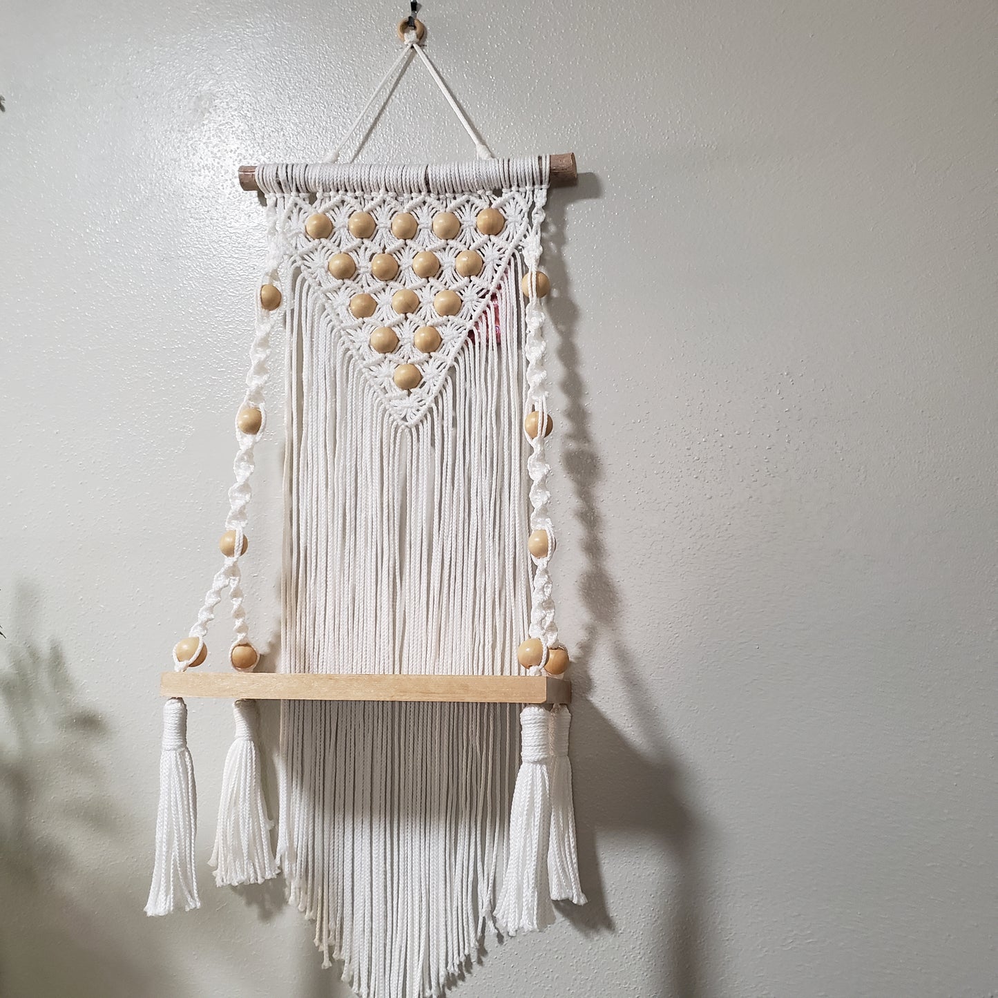 White large shelf with beads