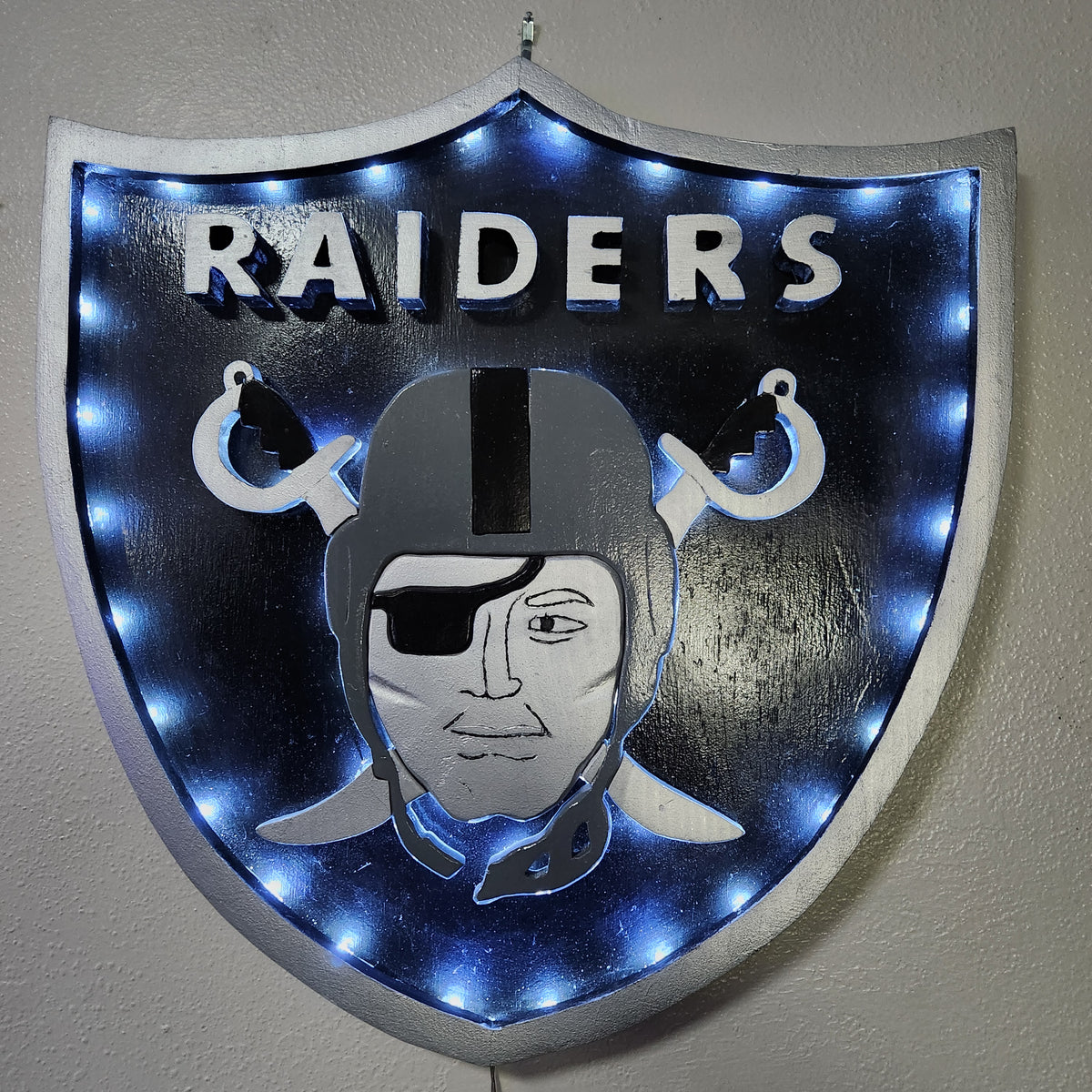 Handcrafted Raiders-Inspired Wood Wall Art – Black & Silver 18x17" Shield Sign