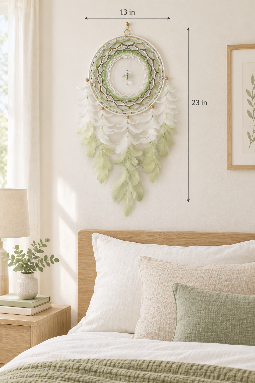 Handcrafted olive green angel dream catcher above a bed in a light bedroom, 13 x 23 inches
