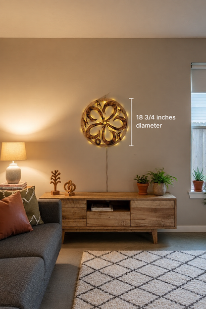 Illuminated burnt-wood Ohana wall art in a living room, labeled 18¾ inches in diameter