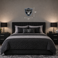 Smaller Raiders shield above queen bed
