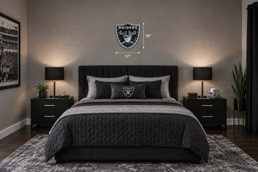 Smaller Raiders shield above queen bed
